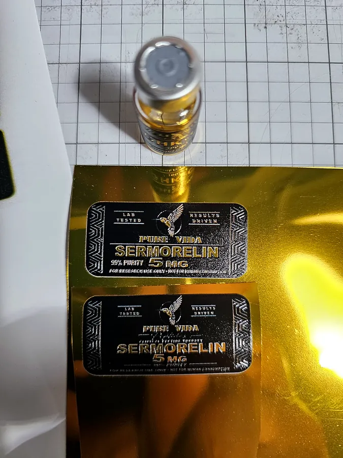 Vial over gold label sheet